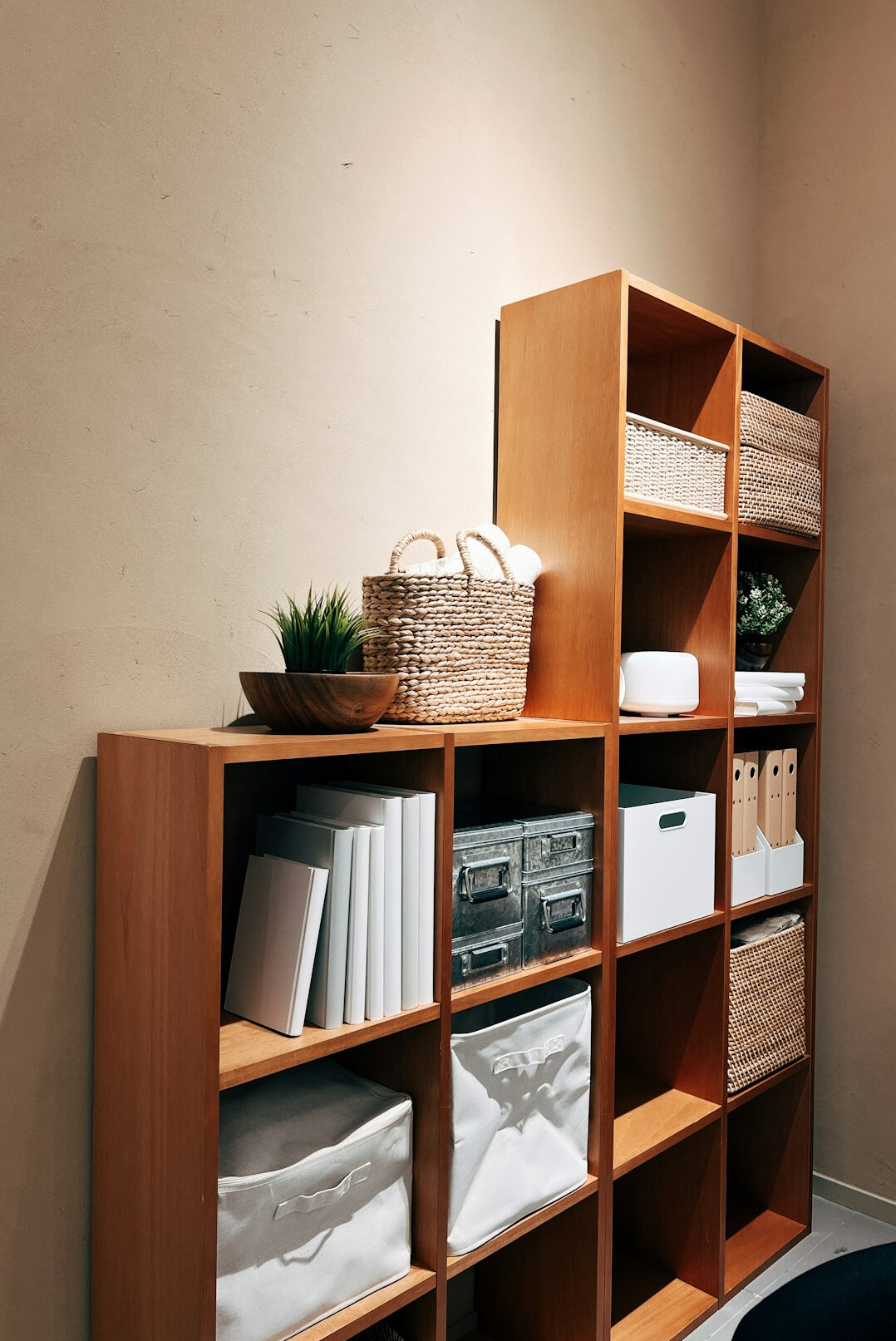 Wooden storage shelves with boxes and baskets