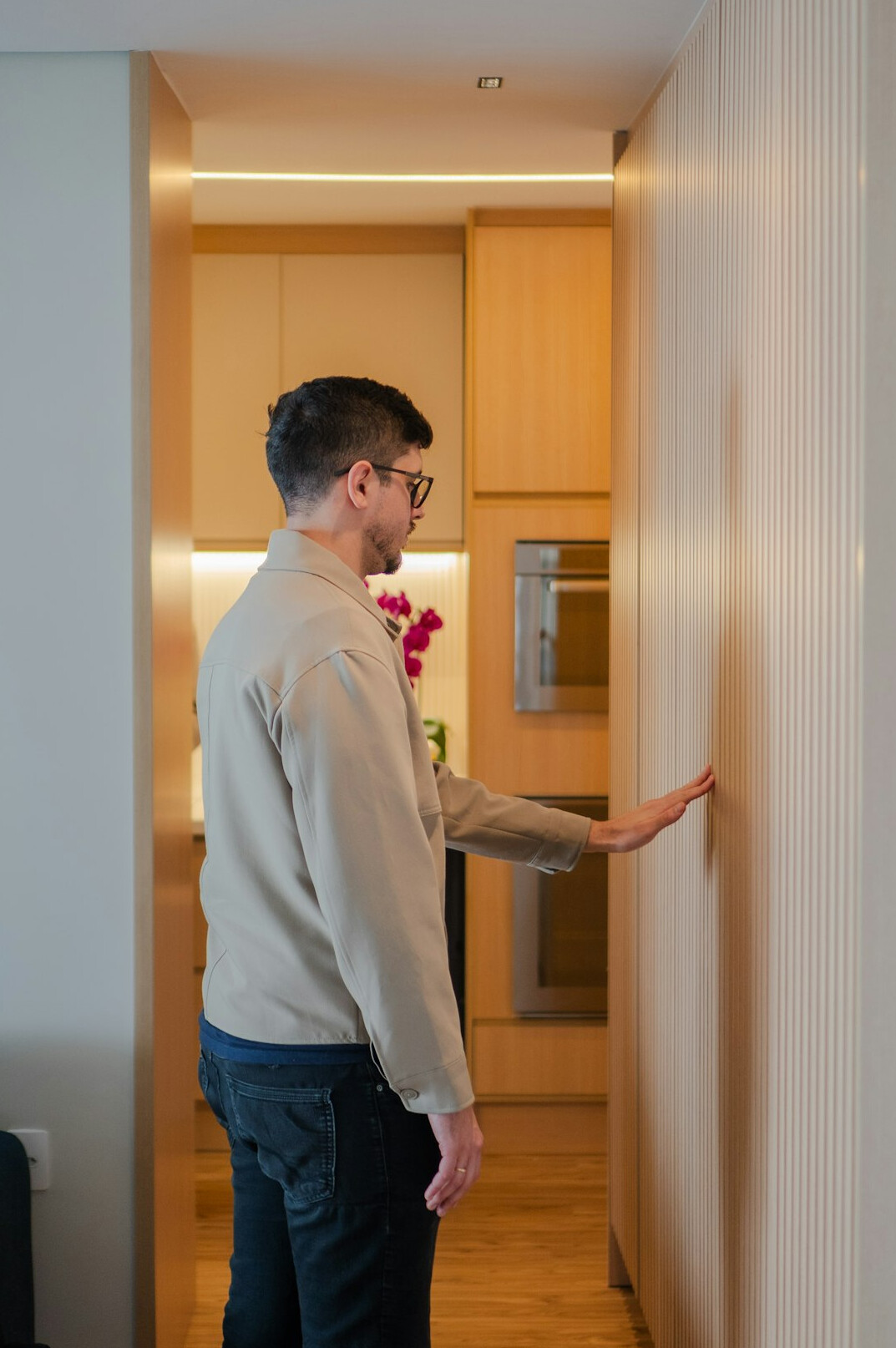 person organizing kitchen cabinets