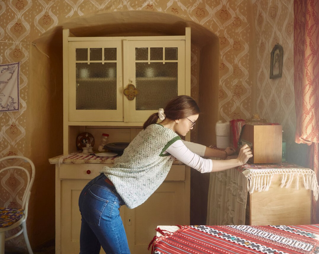 woman dusting furniture